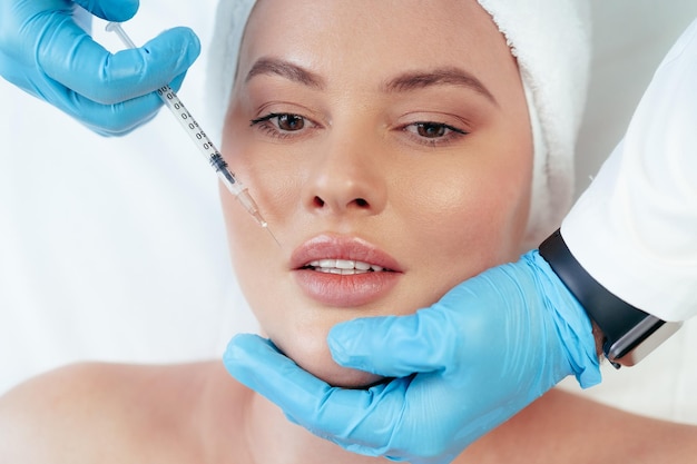 portrait-beautiful-woman-having-injection-botox-her-face_93675-140294