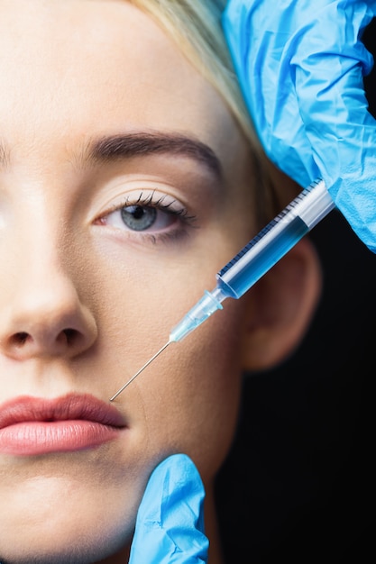 woman-receiving-injection-her-lips_107420-40642